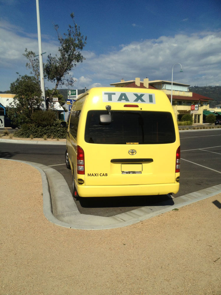 yellow maxi taxi